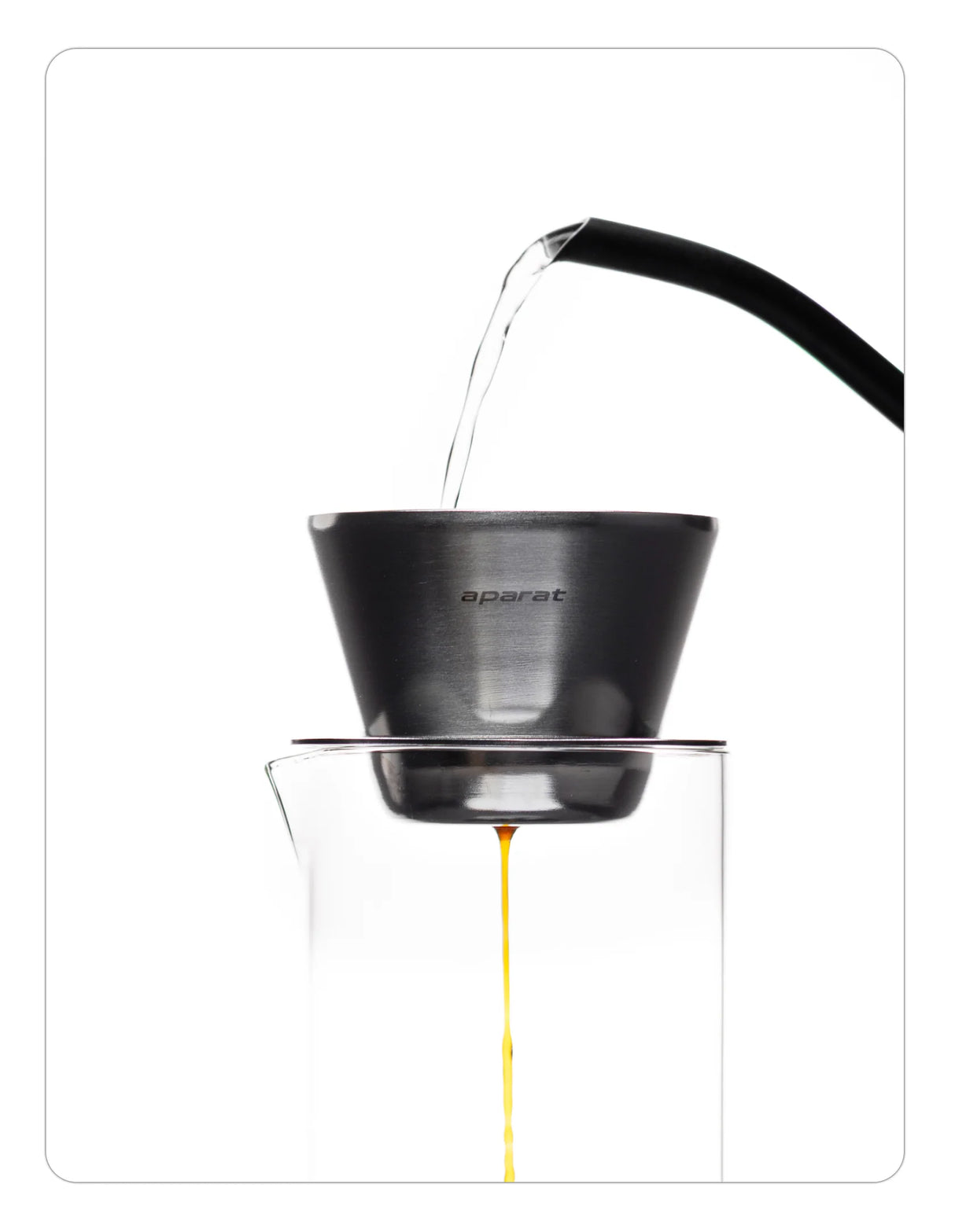 OREA 01 raw steel coffee dripper being used to brew coffee into a glass vessel on a white background