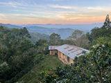 Beautiful view of the mountains and farm house on Las Etíopes farm, Peru